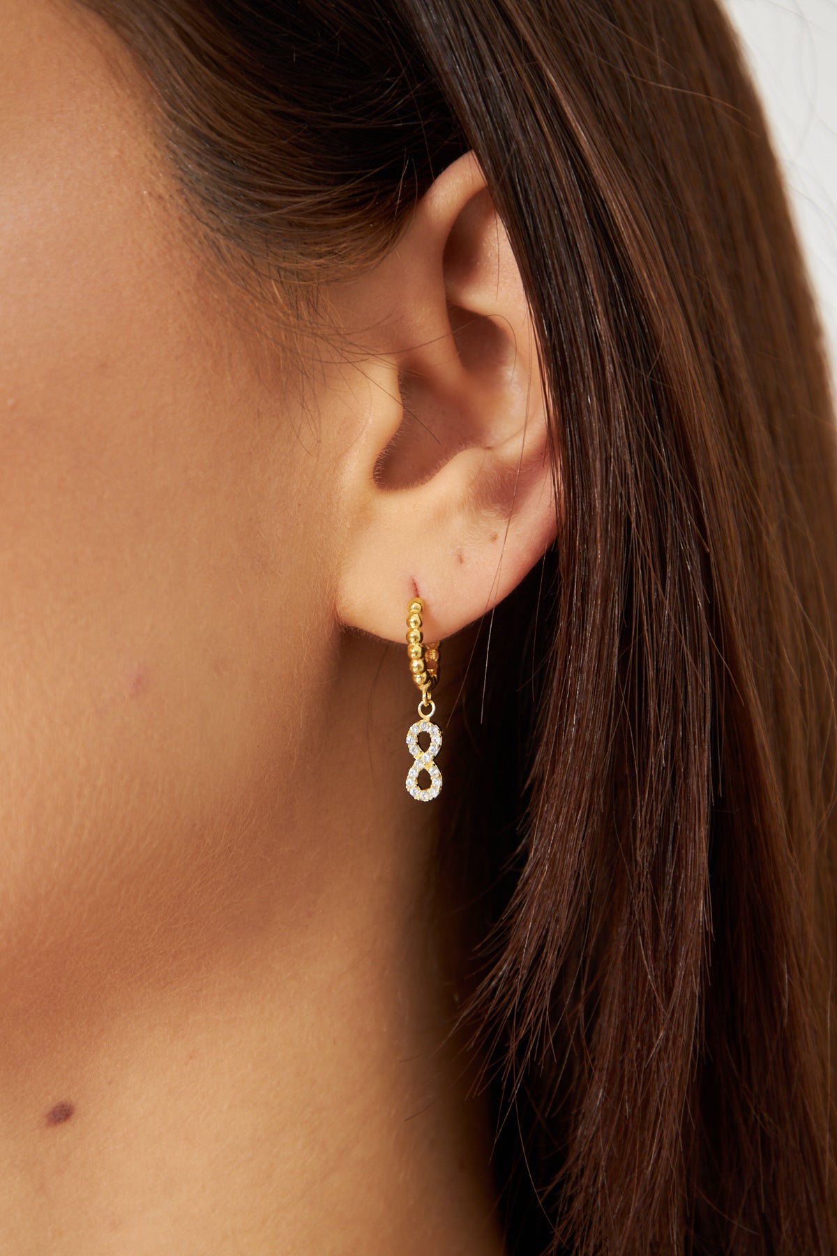 Gold Hoop Earring with Infinity Symbol Pendant and Zircon Stones